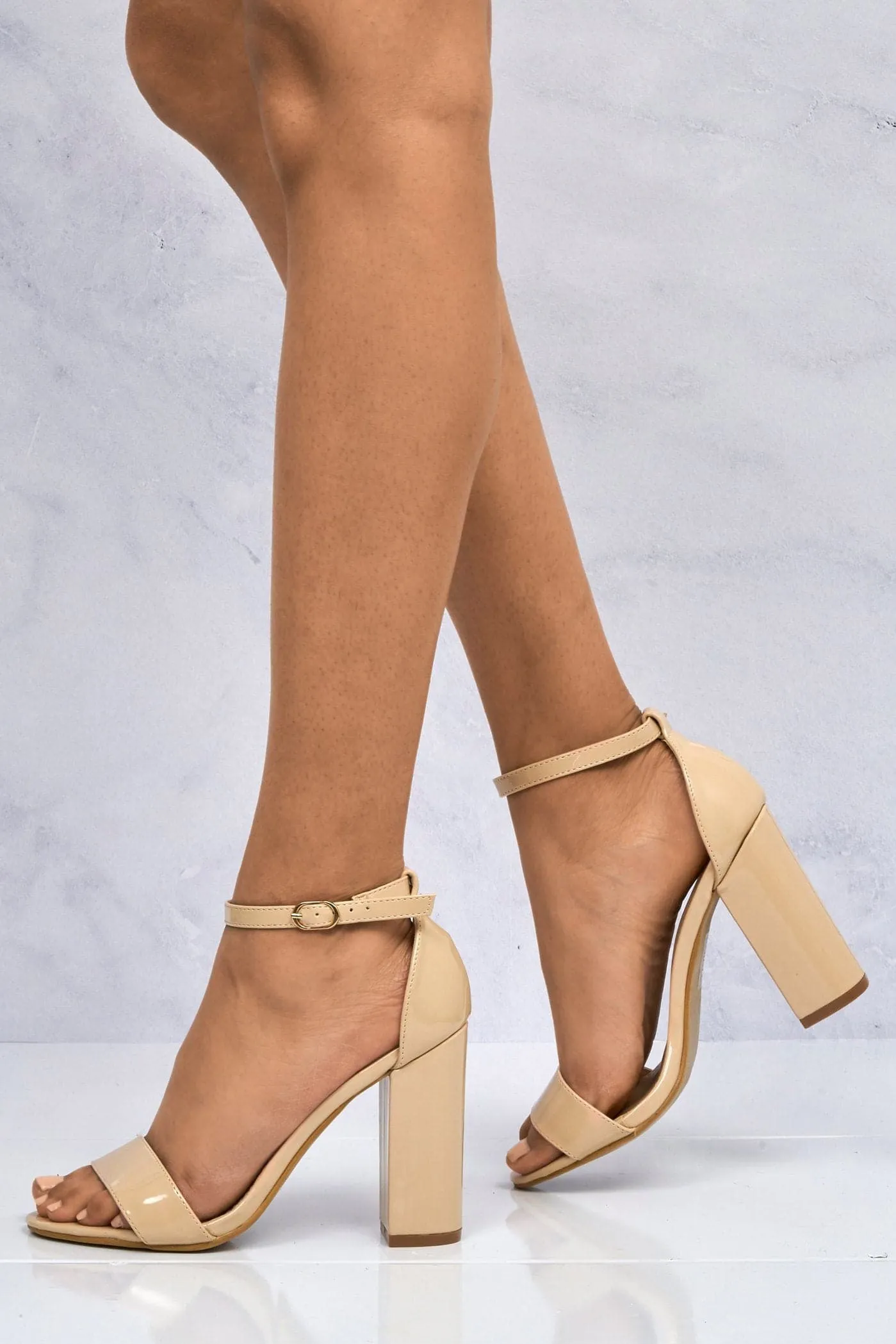 May Barely There Block Heel Ankle Strap Sandal in Nude Patent